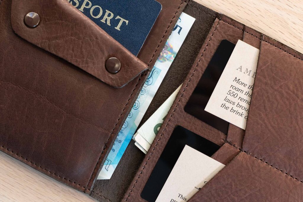 Two Bill Slots For Foreign Currency Two Bill Slots Inside With Folded Us Dollars And Unfolded British Pound Bills