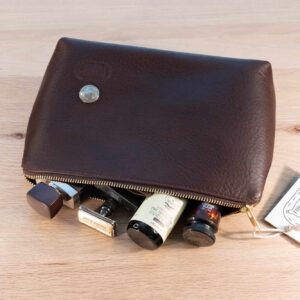 Brown Leather Dopp Kit holding mens shaving kit.
