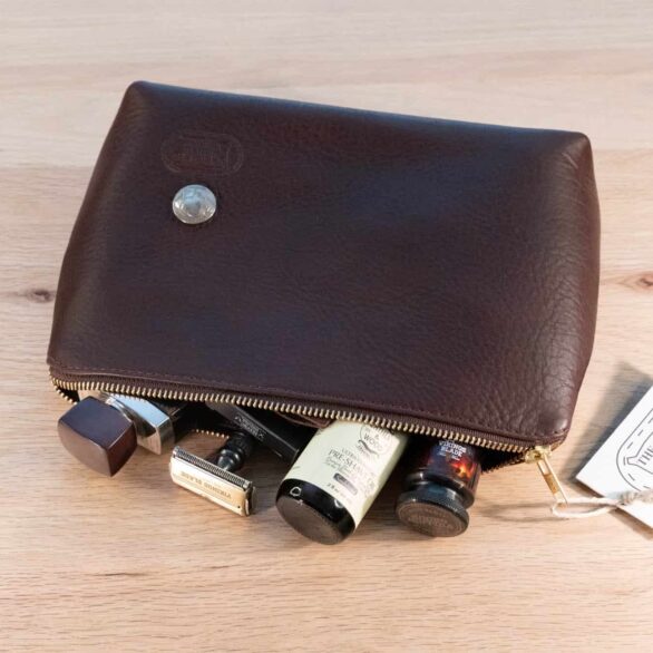 Brown Leather Dopp Kit holding mens shaving kit.