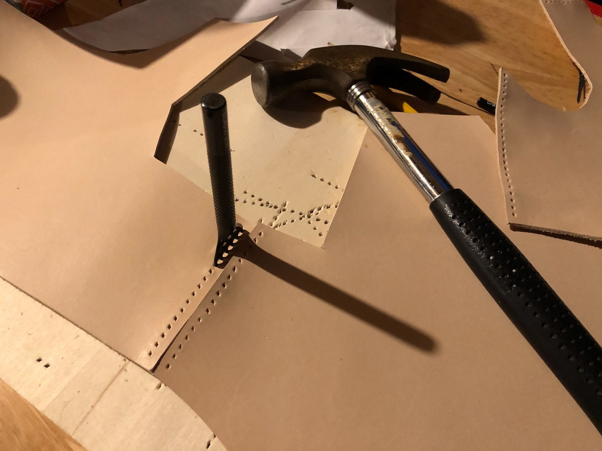 Punching-Holes-In-Leather-Cuirass-Pieces How To Make Leather Armor