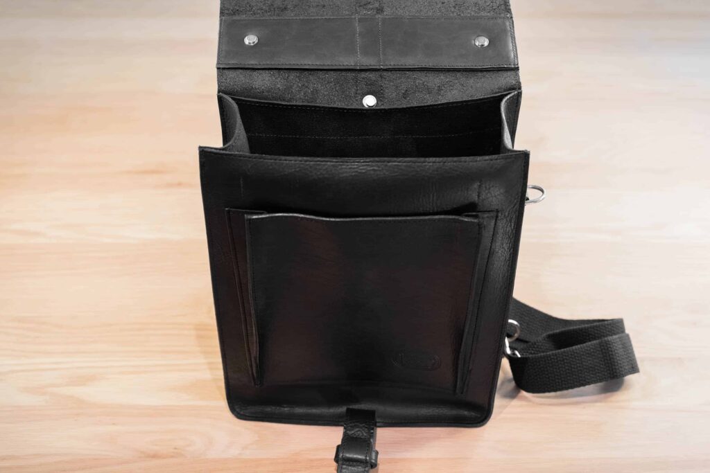 Black Full Grain Leather Backpack Opened Up And Empty Black Full Grain Leather Backpack Opened Up And Empty