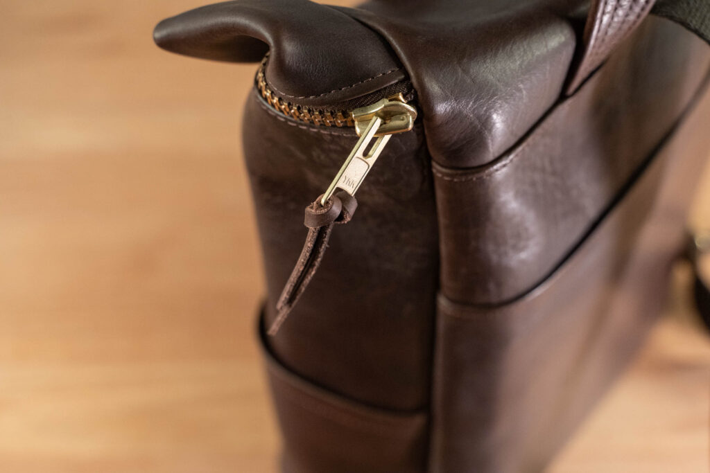 Northbound Backpack Brass Zipper Detail Brass Zipper Detail On Northbound Bison Leather Backpack